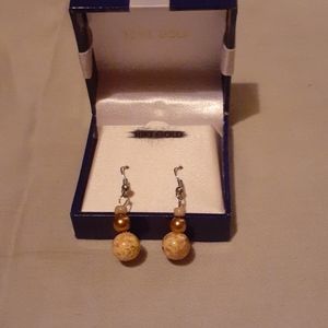 Handcrafted pick and gold earrings